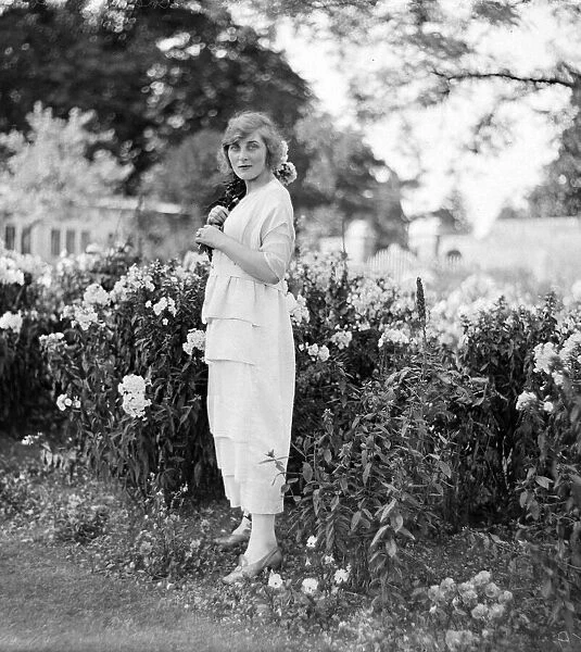 Actress and socialite Isobel Epsom seen here relaxing in the garden Circa 1919