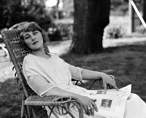 Actress and socialite Isobel Epsom seen here relaxing in the garden Circa 1919