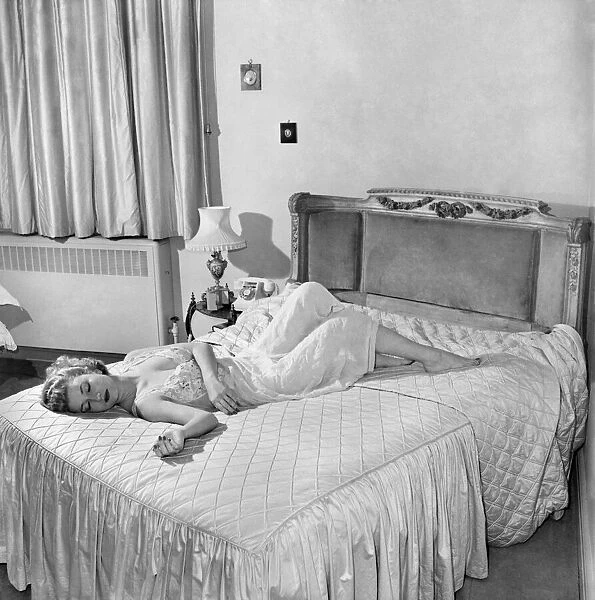 Actress Zena Marshall asleep. December 1953 D7606