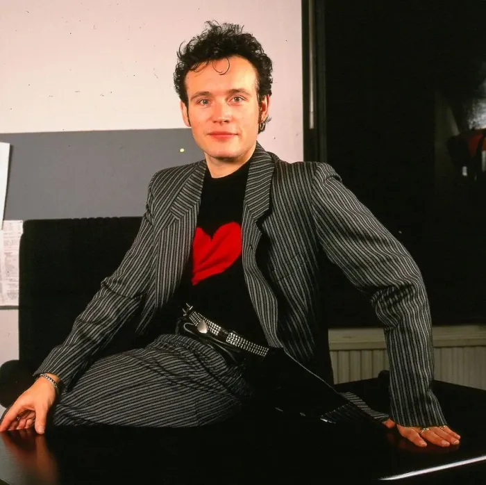 Framed Print : Adam Ant pop singer sitting on desk January 1990 Striped suit black jumper red Framed Print : Adam Ant pop singer sitting on desk January 1990 Striped suit black jumper red