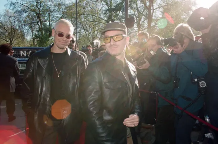 Framed Print : Adam Clayton and Bono of U2 arriving at The Park Lane Hotel for the Q Magazine Awards