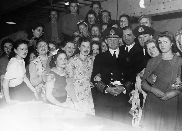 Admiral Sir Gerald Dickens among the girls that gave him a cheque for Cardiff Warship