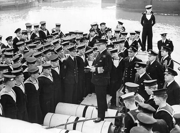 Admiral Sir Percy Lockhart Harnam Noble seen here congratulating the crew of HMS Stork