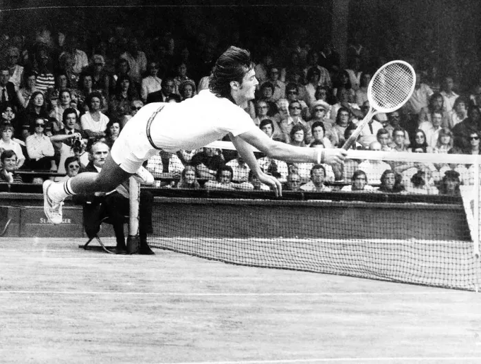 Framed Print : Adriano Panatta Tennis Player diving on court Aug 1976 to score a winning point against Framed Print : Adriano Panatta Tennis Player diving on court Aug 1976 to score a winning point against