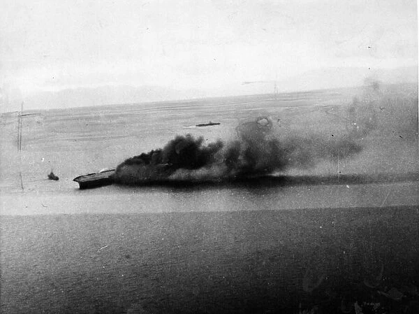 Aerial images of HMS Ark Royal healing over to starboard after being torpedoed by German