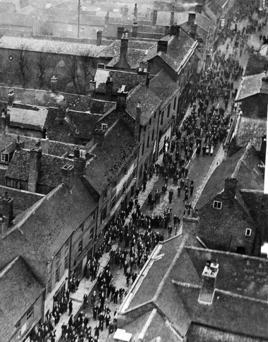 Framed Print : Aerial view of the annual Shrove Tuesday football game which takes place along the high Framed Print : Aerial view of the annual Shrove Tuesday football game which takes place along the high