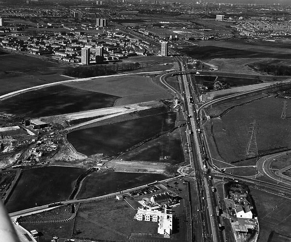Aerial view of M57 Motorway, The East Lancashire Road is seen (right