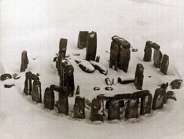 An aerial view of the ruins of Stonehenge in Wiltshire covered in snow January