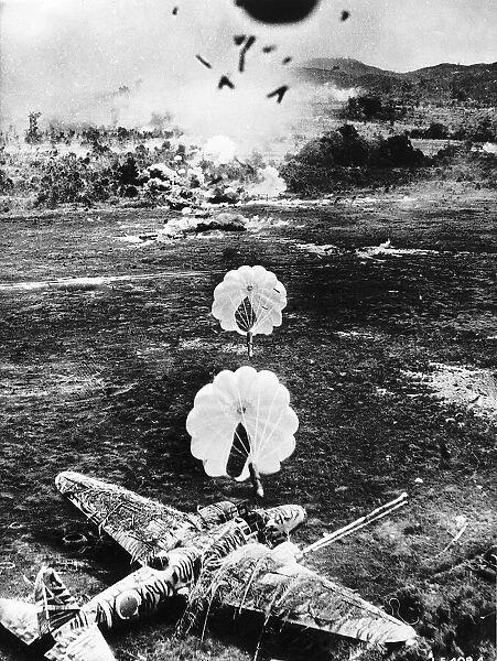 The US Air Force drop parafrag bombs on a Japanese airfield during WW2