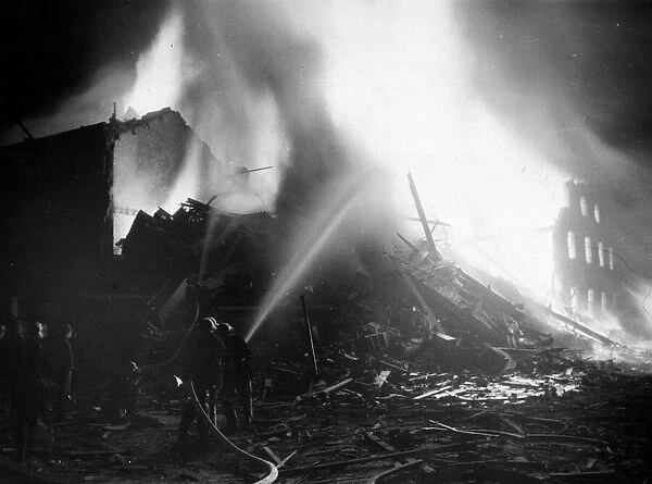 An air raid causes damage to buildings in Ebury Street, Pimlico, London. 16th April 1941