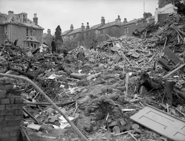 Framed Print : Air raid damage in Coventry Civilians search the rubble of thier bomb damaged