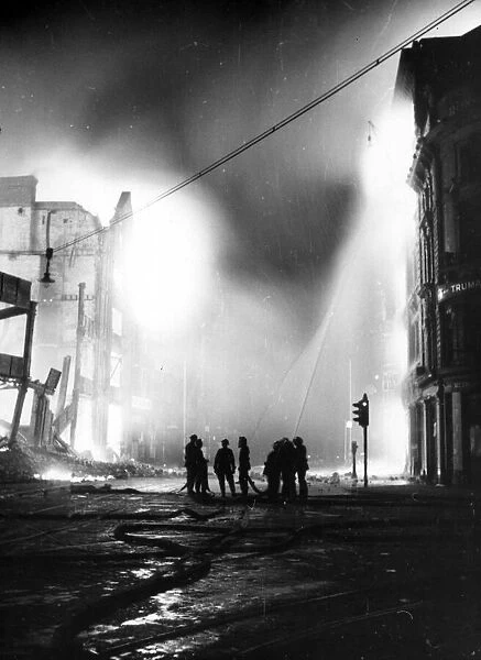 An air raid damages buildings in Ebury Street, Pimlico. 16th April 1941