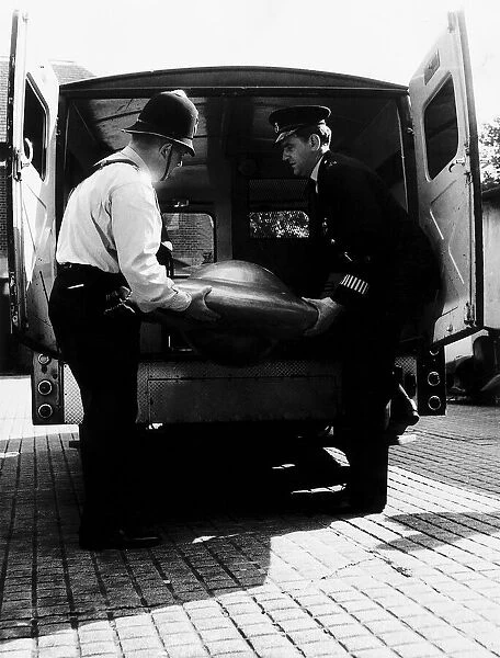 Air UFOs two policemen from Bromley Police Station unload van with suspected UFO that was