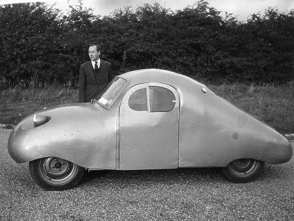 Air Vice Marshall Donald Bennett beisdes the new peoples car he has produced