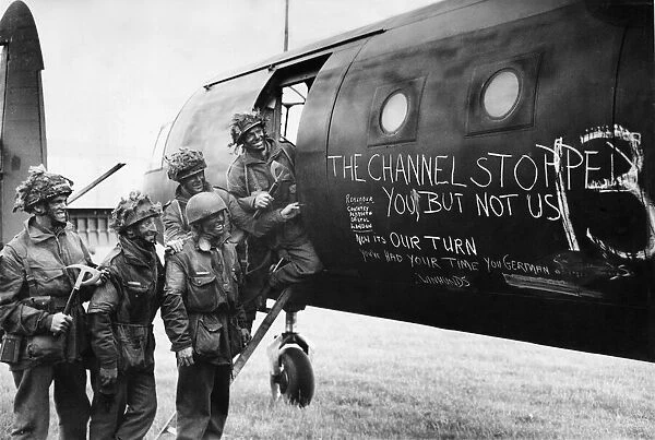 Airborne troops of 6th Airlanding infantry Brigade admire the graffiti chalked