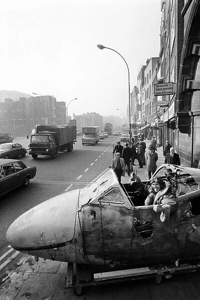 Aircraft arrives in Whitechapel High Street for art show, London. 24th February 1975