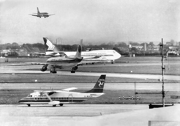 Aircraft coming and going at Londons Heathrow Airport. November 1986 P004352