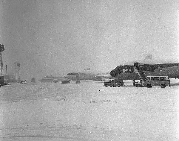 Aircraft parked at Heathrow Airport during a blizard in March 1965