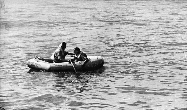Two airmen adrift in their dinghy in the Indian Ocean. A Hurricane on patrol sighted