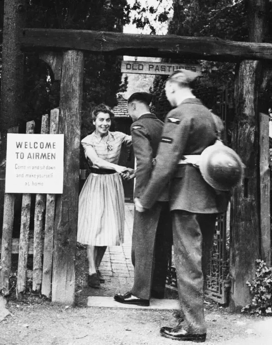 Framed Print : Airmen in Britain. (Picture) Airmen receive a warm welcome to the Old World Garden