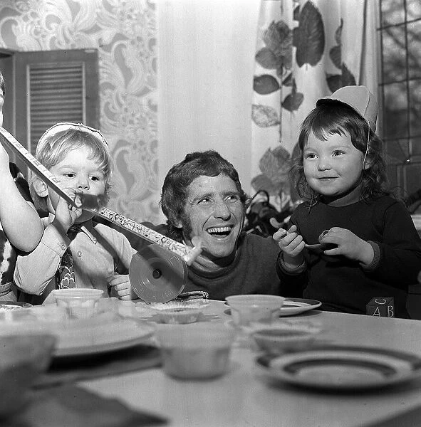 Alan Ball enjoys the third birthday party of his daughter Mandy (right