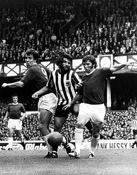 Alan Ball and Joe Royle of Everton sandwiched Trevor Huckey of Sheffield United in a