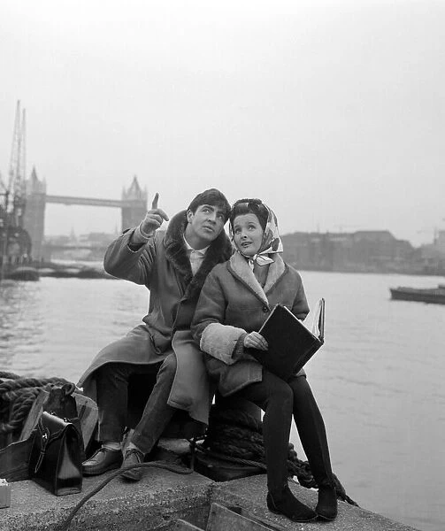 Alan Bates and Millicent Martin by the Thames during filming of