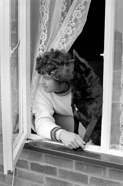 Alan Learmouth and Dog 'Dollar': Alan and aDollare keep watch at the window for