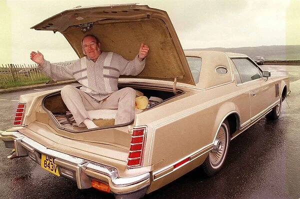 Alan Robertson sitting inside boot of his Lincoln Continental June 1999