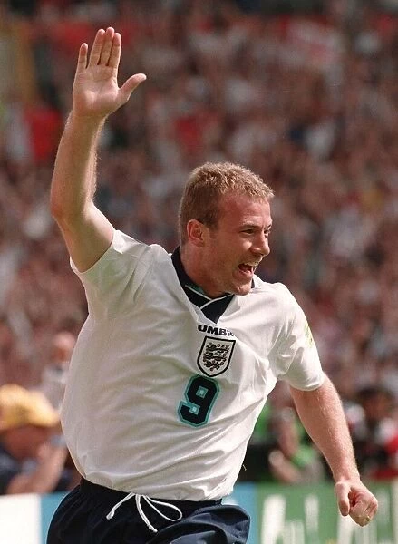 ALAN SHEARER WITH ARM RAISED CELEBRATING GOAL FOR ENGLAND AGAINST SCOTLAND DURING EURO 96