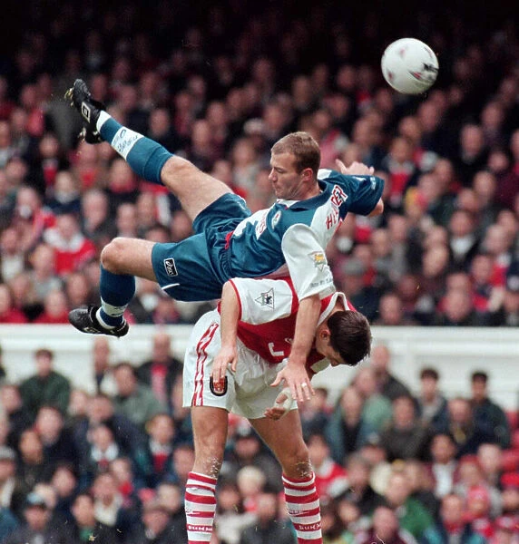 Alan Shearer of Blackburn Rovers and Arsenals Tony Adams challange for the ball in