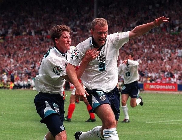 Alan Shearer celebrates Englands opening goal with Darren Anderton during the 1996