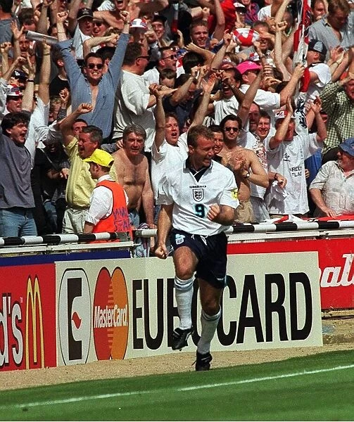 Alan Shearer of England celebrates after scoring against Scotland during the European
