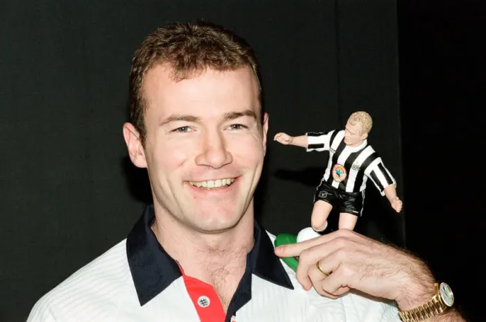 Framed Print : Alan Shearer holding his soccer figure from the Soccer Superheroes collection