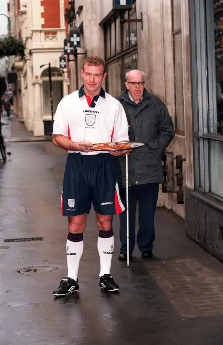 Framed Print : ALAN SHEARER MODELLING THE NEW 1997 ENGLAND HOME STRIP AND HOLDING A