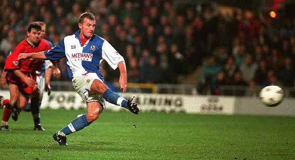 Alan Shearer scores his second goal from the penalty spot for Blackburn Rovers against