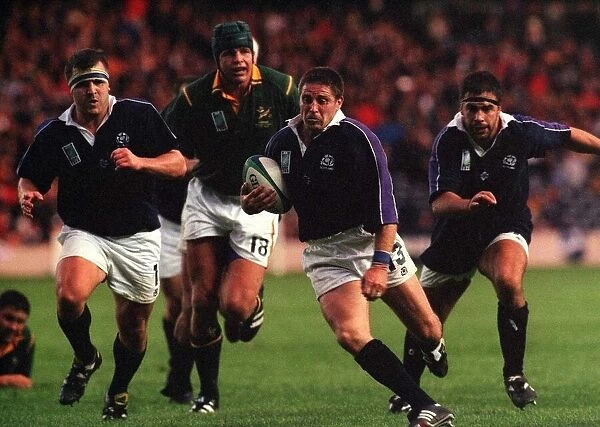 Alan Tait breaks through the South Africans to score a try for Scotland October 1999