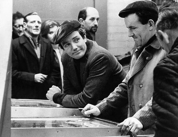Albert Finney (centre) and Colin Blakely (right) in Manchester Amusement Arcade during