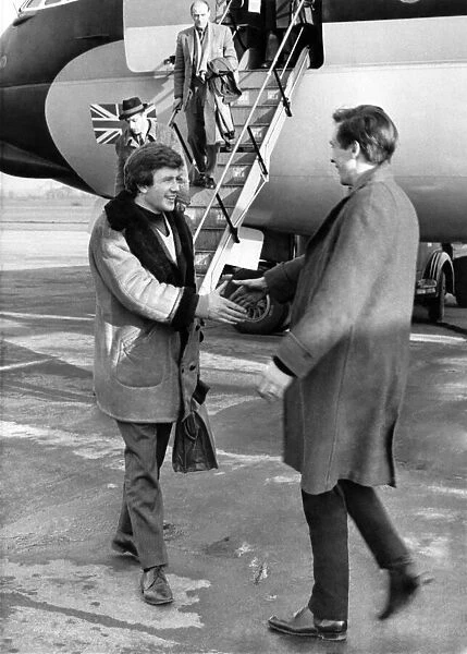 Albert Finney seen here being greeted on the apron of Manchester airport