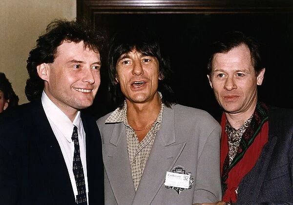 Alex Higgins poses with fellow snooker player Jimmy White and Ronnie Wood