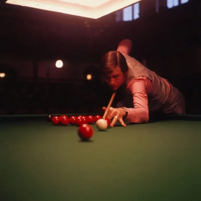 Framed Print : Alex Higgins, snooker player about to play a shot. Circa 1972