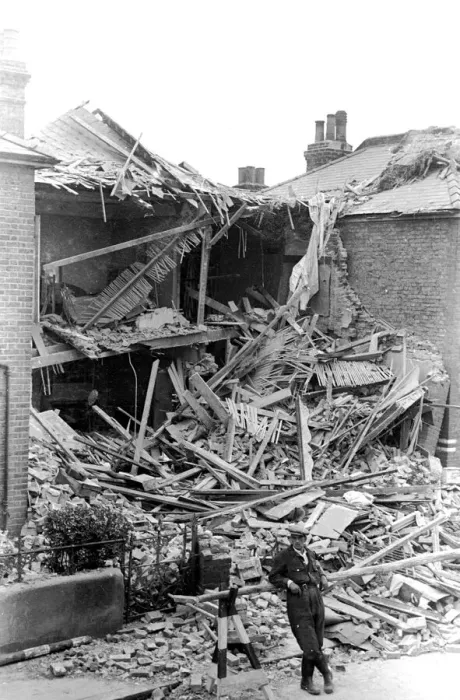 Framed Print : Alfieri. Air Raid damage, Malden. Man standing outside house which has taken a Framed Print : Alfieri. Air Raid damage, Malden. Man standing outside house which has taken a