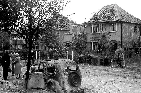 Alfieri. Air raid damage at Malden, London. General scenes of wrecked buildings and car