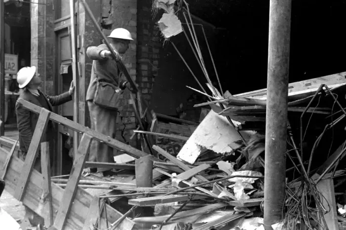 Framed Print : Alfieri. Air raid damage at Malden, London. Two civil volunteers search through Framed Print : Alfieri. Air raid damage at Malden, London. Two civil volunteers search through