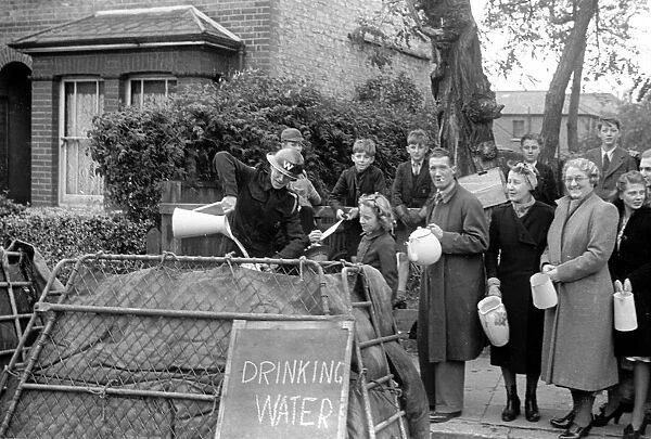 Alfieri. Civil Guard pours out drinking water during Invasion Exercises, Kingston, London