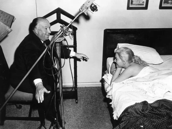 Framed Print : Alfred Hitchcock Film Director gives Kim Novak instructions July 1958 Framed Print : Alfred Hitchcock Film Director gives Kim Novak instructions July 1958