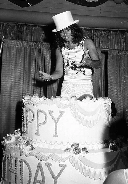 Alice Cooper American rock singer jumps out of a birthday cake 1975