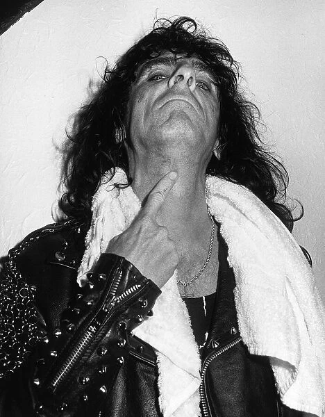 Alice Cooper American rock singer shows the marks on his neck after a stage stunt went
