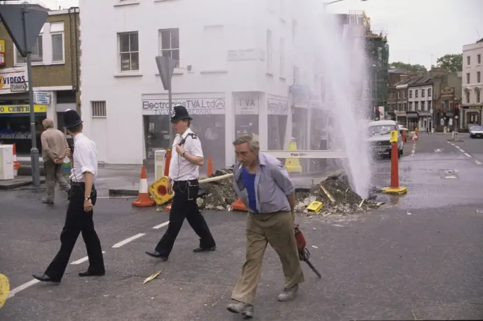 Framed Print : Alisdair MacDonalds 1988 award winning picture of a watermain in Pimlico after a