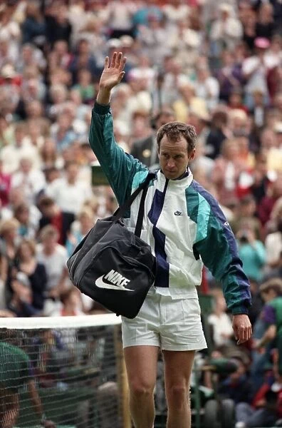 All England Lawn Tennis Championships at Wimbledon. John McEnroe waves to